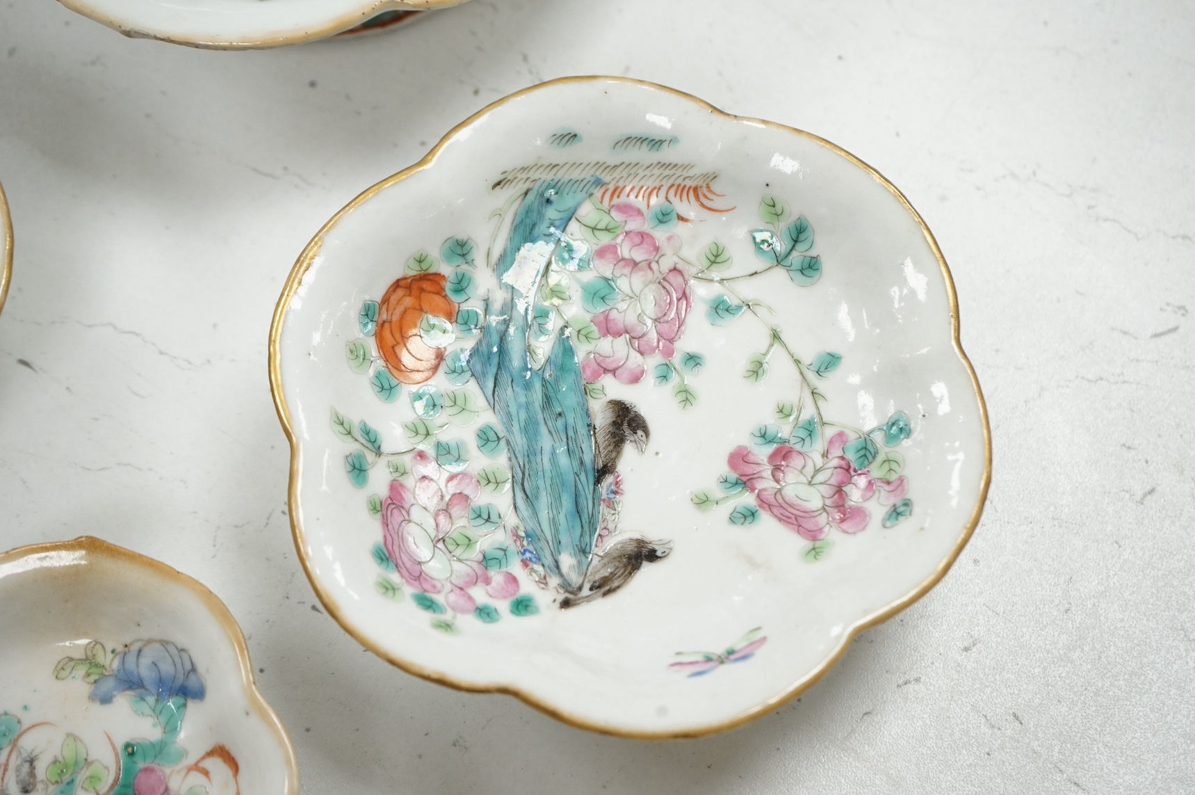 Four graduated Chinese famille rose dishes, late 19th century, largest, 16cm diameter. Condition - glazing flaws, otherwise good